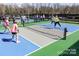 Outdoor pickleball courts in use with players in action, showcasing the active lifestyle at 6044 Great Basin Ln, Fort Mill, SC 29707