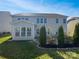 Spacious backyard featuring a lush green lawn, mature trees, and a patio area at 6234 Artigas Dr, Fort Mill, SC 29707