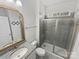 Clean bathroom featuring a glass-enclosed shower, granite countertop, and updated fixtures at 6234 Artigas Dr, Fort Mill, SC 29707