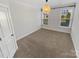 Cozy bedroom with neutral carpet, two windows, and ample natural light at 6234 Artigas Dr, Fort Mill, SC 29707