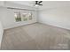 Spacious bedroom featuring plush carpeting and large windows at 6234 Artigas Dr, Fort Mill, SC 29707