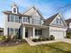 Beautiful two-story home with a well-manicured front yard and inviting entrance at 6234 Artigas Dr, Fort Mill, SC 29707