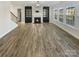 Bright living room featuring hardwood floors and a fireplace at 6234 Artigas Dr, Fort Mill, SC 29707