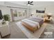 Cozy main bedroom with a ceiling fan, large windows, and a plush rug at 6234 Artigas Dr, Fort Mill, SC 29707