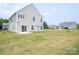 Spacious backyard with a well-maintained lawn and patio at 730 Autumn Sage Dr, Indian Trail, NC 28079