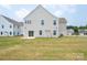 Large backyard featuring a covered patio and lush green lawn at 730 Autumn Sage Dr, Indian Trail, NC 28079