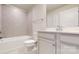 Bright bathroom featuring modern tile flooring, toilet, and vanity with undermount sink at 730 Autumn Sage Dr, Indian Trail, NC 28079