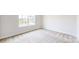 Bright bedroom with a large window providing natural light, and neutral carpeting at 730 Autumn Sage Dr, Indian Trail, NC 28079