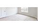 Bedroom featuring neutral carpet, a window, and white walls at 730 Autumn Sage Dr, Indian Trail, NC 28079