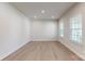 Neutral bedroom with hardwood flooring and natural light from two windows at 730 Autumn Sage Dr, Indian Trail, NC 28079