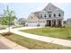 Charming two-story home featuring a three-car garage and covered front porch at 730 Autumn Sage Dr, Indian Trail, NC 28079