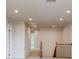 Second floor hallway with neutral walls and carpeting, and recessed lighting at 730 Autumn Sage Dr, Indian Trail, NC 28079