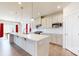 Bright kitchen featuring an island, stainless steel appliances and white cabinetry at 730 Autumn Sage Dr, Indian Trail, NC 28079