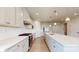 Modern kitchen featuring stainless steel appliances, white countertops, and hardwood floors at 730 Autumn Sage Dr, Indian Trail, NC 28079