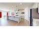 Modern kitchen with stainless steel appliances, large island, and pendant lighting at 730 Autumn Sage Dr, Indian Trail, NC 28079