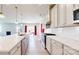 Modern kitchen with stainless steel appliances, a large island, and open to the living room at 730 Autumn Sage Dr, Indian Trail, NC 28079