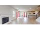 Open-concept living room with fireplace and view of the modern kitchen at 730 Autumn Sage Dr, Indian Trail, NC 28079