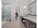 Elegant bathroom with double sinks, a glass shower, and contemporary design at 82116 Standing Oak Dr, Charlotte, NC 28278