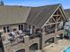 Impressive aerial view of the clubhouse with an outdoor seating area overlooking the pool at 82116 Standing Oak Dr, Charlotte, NC 28278