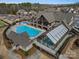 Stunning aerial view of the community pool area with clubhouse and recreational facilities at 82116 Standing Oak Dr, Charlotte, NC 28278