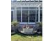 Cozy porch featuring decorative plants and flowers, complemented by stone pillar accents at 82116 Standing Oak Dr, Charlotte, NC 28278