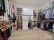 Spacious walk-in closet with custom shelving and ample storage space at 82116 Standing Oak Dr, Charlotte, NC 28278