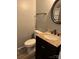 Bathroom featuring a sink with granite countertop, a dark vanity and a toilet at 948 Shannon Bradley Rd, Gastonia, NC 28052