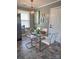 A modern dining area featuring a glass table, white chairs, and contemporary decor at 948 Shannon Bradley Rd, Gastonia, NC 28052