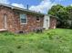 Exterior view of the property showing a brick wall and lawn at 948 Shannon Bradley Rd, Gastonia, NC 28052
