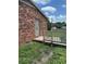 View of the exterior of the home featuring a brick wall and wood railing at 948 Shannon Bradley Rd, Gastonia, NC 28052