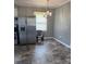 Kitchen and dining space featuring stainless steel appliances and a modern chandelier at 948 Shannon Bradley Rd, Gastonia, NC 28052