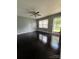Spacious living room with hardwood floors and a ceiling fan, offering a comfortable space for relaxation and entertaining at 948 Shannon Bradley Rd, Gastonia, NC 28052