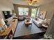 A beautifully staged living room with modern furnishings, a large window, and neutral colors at 948 Shannon Bradley Rd, Gastonia, NC 28052