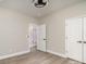 Bedroom with wood-look flooring, showing a walk-in closet and ensuite bathroom at 1010 Wilmouth St, Shelby, NC 28152