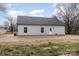 This exterior shows the back of the house featuring gray siding and a dark roof at 1010 Wilmouth St, Shelby, NC 28152