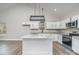 Bright kitchen featuring a large island, granite countertops, and stainless steel appliances at 1010 Wilmouth St, Shelby, NC 28152