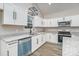 Modern kitchen featuring white cabinets, granite countertops, and stainless appliances at 1010 Wilmouth St, Shelby, NC 28152