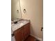 Bathroom featuring granite countertop with a white sink and dark hardware at 1043 Boxelder Ln, Charlotte, NC 28262