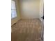 A bright bedroom with neutral carpet and walls, and a window letting in natural light at 1043 Boxelder Ln, Charlotte, NC 28262