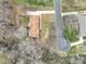 Birds-eye view of brick home with adjacent street and mature trees at 107 S Myrtle Ave, China Grove, NC 28023