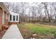 Large backyard featuring a well-maintained lawn, mature trees, and a fenced-in area at 107 S Myrtle Ave, China Grove, NC 28023