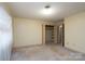 Light-filled bedroom with closet and doorway at 107 S Myrtle Ave, China Grove, NC 28023