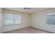 Simple bedroom featuring two windows with blinds and electrical outlets at 107 S Myrtle Ave, China Grove, NC 28023