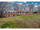 Spacious home with a brick exterior, a front porch, and a sprawling front lawn at 107 S Myrtle Ave, China Grove, NC 28023