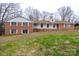 Charming brick home with a well-manicured lawn and inviting front porch at 107 S Myrtle Ave, China Grove, NC 28023