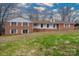 Charming brick home featuring classic white shutters and a welcoming front porch at 107 S Myrtle Ave, China Grove, NC 28023
