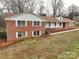 Brick home featuring classic white shutters at 107 S Myrtle Ave, China Grove, NC 28023