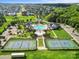 An inviting aerial view of community amenities featuring a pool, tennis courts, and playground at 1082 Dorsey Dr, Fort Mill, SC 29715