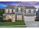 Charming two-story home featuring a manicured lawn and a two-car garage, perfect for Gathering living at 1082 Dorsey Dr, Fort Mill, SC 29715