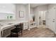 This stylish hallway features a built-in desk, convenient storage, and an entrance to the laundry room at 1082 Dorsey Dr, Fort Mill, SC 29715